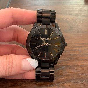 Michael Kors black and gold Woman’s watch
